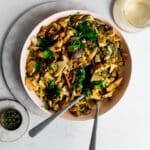 Braised mushrooms in a bowl with chopped parsley