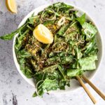 Dandelion salad garnished with breadcrumbs and lemon