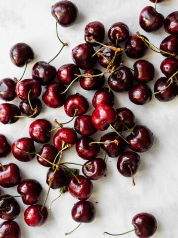 a large grouping of cherries