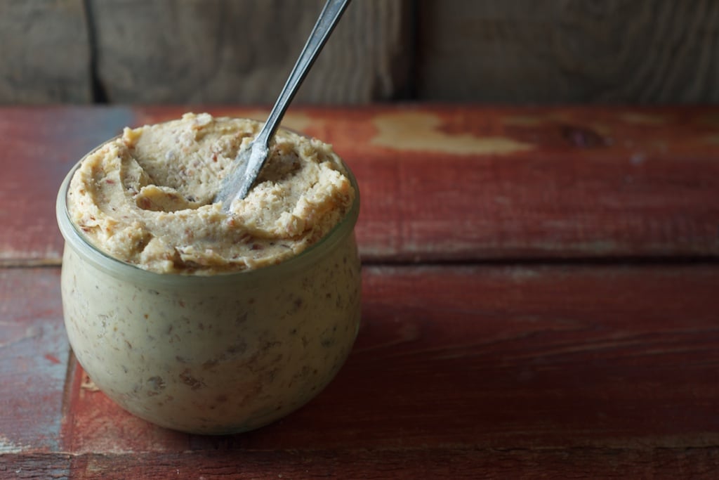 potted cheese in jar on wooden surface