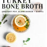 pinterest pin turkey bone broth garnished with herbs and lemon